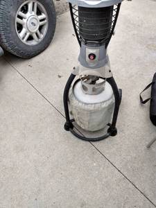 lot 4455 image: patio heater with empty bottle untested 40 in tall