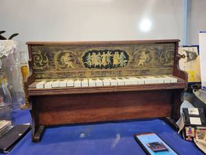 lot 5565 image: A late 1800s Schoenhuts12 key children piano with lithograph angels