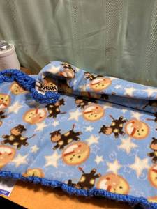 lot 7408 image: Childs throw Which crocheting around the edges