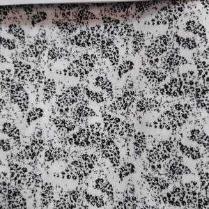 lot 8068 image: DEKOTH COTTON FABRIC WHITE AND BLACK LEAF