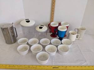 lot 486 image: Custard dishes, (2) canisters, plastic cups & metal pitcher