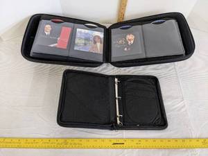 lot 489 image: (2) DVDCD holders 1 full of CDS (See picture for titles)