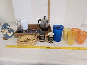 lot 570 image: Plastic drinking glasses, salt & pepper shakers, coasters & more