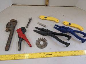 lot 673 image: Pipe wrench, box opener, wire cable stripper & nail guides