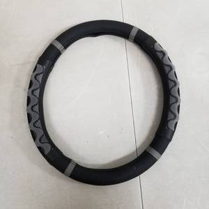 lot 7486 image: Grey and Black Steering Wheel Cover