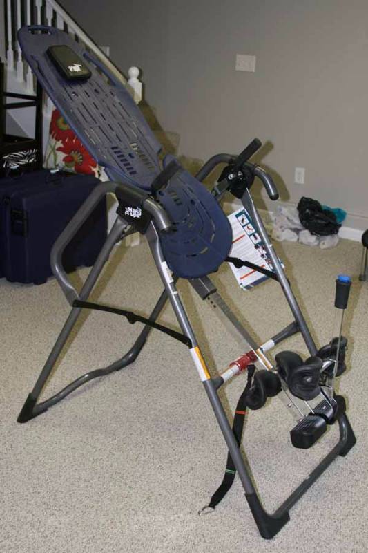 lot 5448 image: Teeter Hang-ups inversion table - New.  Folds up - great for back problems