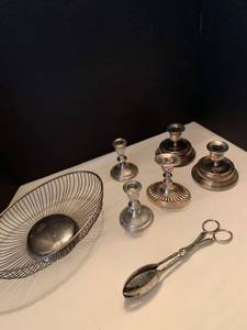 lot 1025 image: Silver plate candle stick holders bowl and salad tongs