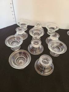 lot 1101 image: Eleven invertible candle holders for tapers and votives and two others