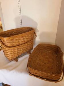 lot 1229 image: Longaberger baskets one has hole