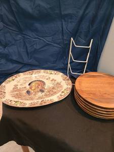 lot 1317 image: Six MCM teak molded plates (have scratch marks), 18 wide turkey platter
