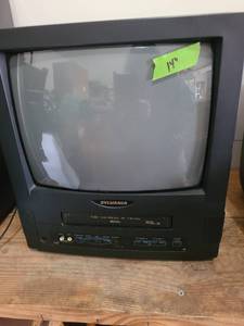 lot 3025 image: Sylvania 14 inch t.v. with VHS player