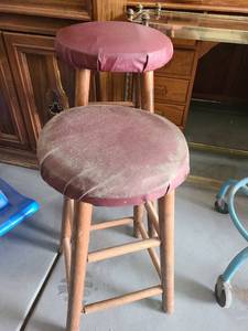 lot 3053 image: 2 Bar stools. 24 and 29 inches tall. One definitely needs reupholstered.