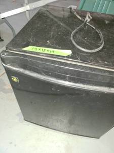 lot 3090 image: GE mini fridge 19 x 18 x 19. Needs cleaning