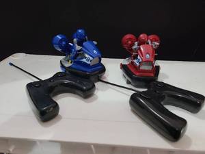 lot 3099 image: Kids remote control sea doos with ppl.