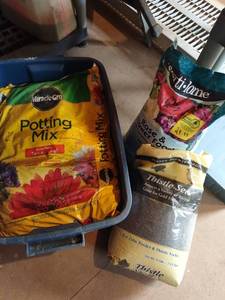 lot 4106 image: Miracle Gro potting mix with Fertilome rose and flower food and Mills Bros thistle seed