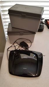 lot 1508 image: Linksys wireless router and 2 plastic storage containers