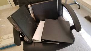 lot 1521 image: Ledger and 3 ring notebooks and empty Nikon case