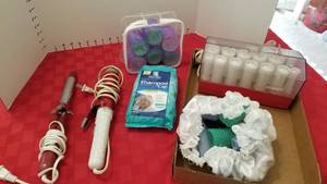 lot 1593 image: Clairol curlers, curling irons and cap
