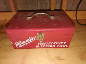 lot 4215 image: Milwaulkee heavy duty electric drill with case and contents