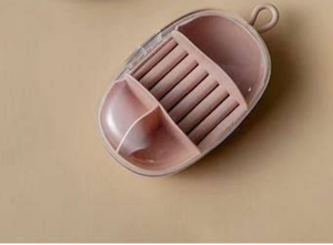 lot 1303 image: Egg Shaped plastic travel jewelry box yellow not pink