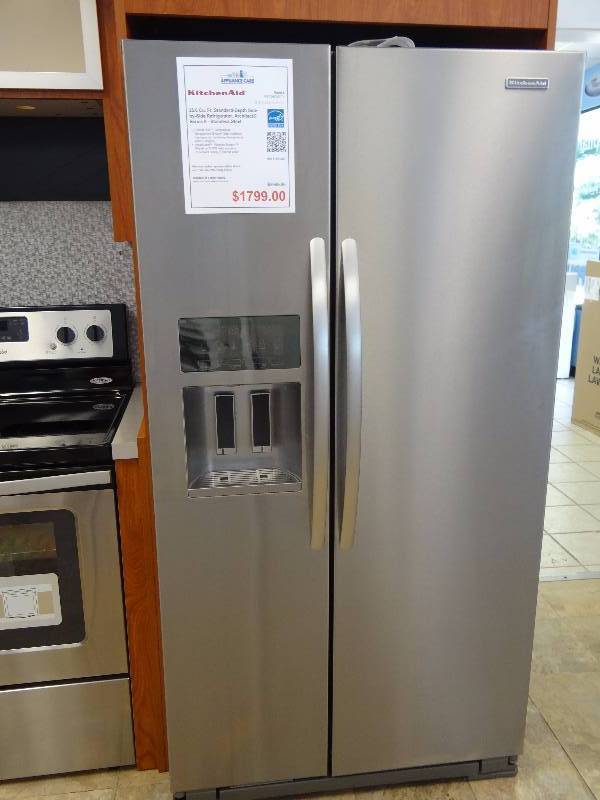 lot 1073 image: BRAND NEW KitchenAid Stainless Steel Side by Side Refrigerator w Built in Ice & Water Dispenser