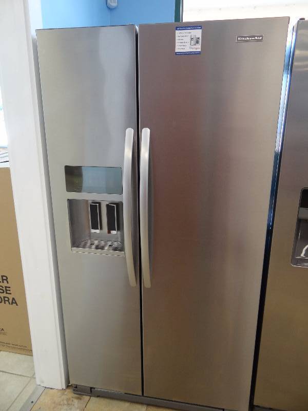 lot 1075 image: BRAND NEW Whirlpool Side by Side Refrigerator w Water & Ice Dispenser