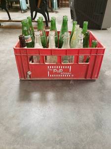 lot 58064 image: Crate of 23 Old Soda Bottles