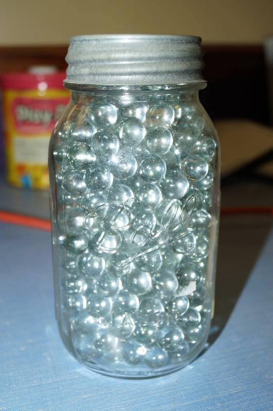 lot 4106 image: Old Ball  Mason Jar with clear marbles