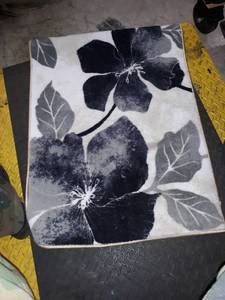 lot 37201 image: gray and black rug with flowers on it