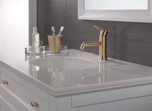 lot 251 image: Delta Faucet Trinsic Single Hole Bathroom Faucet, Gold Bathroom Faucet, Single Handle Bathroom Faucet, Metal Drain Assembly, Champagne Bronze 559LF-CZMPU
