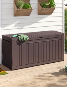 lot 7598 image: Keter Comfy 71 Gallon Resin Plastic Wood Look All Weather Outdoor Storage Deck Box, Brown