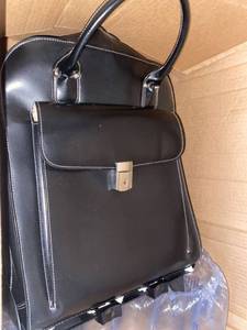 lot 10220 image: BLACK ROLLING SUITCASE WITH LOCK