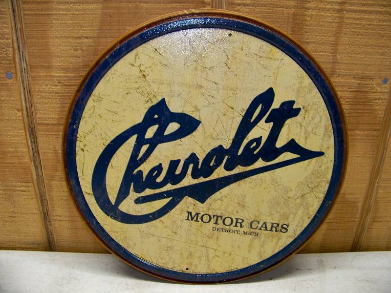 lot 682 image: 7 Chevrolet Historic Logo Tin Signs