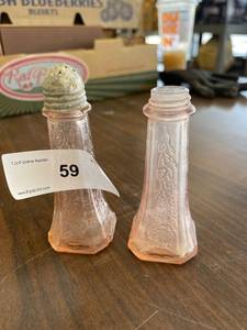 lot 59 image: Pink depression salt and pepper shakers, one with no lid