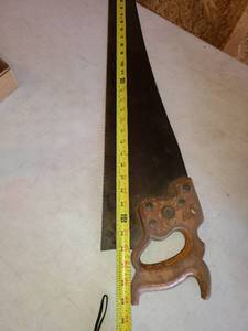 lot 1046 image: Old saw with wooden handle