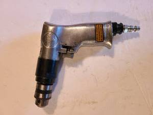 lot 1343 image: Central pneumatic 38 inch reversible air drill