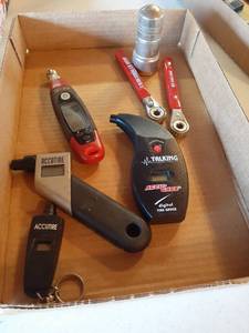 lot 1388 image: Battery operated tire pressure gauge