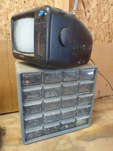 lot 1557 image: 20 drawer bin storage with small tv