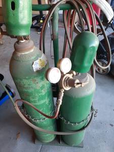 lot 2037 image: Torch with oxygen and acetylene bottles on cart with extras