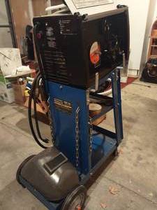 lot 2036 image: Hobart Handler 140 welder with welding cart and helmet