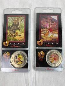 lot 7603 image: Lot of 2 Collectible DISNEY Decades Coins Pooh and Piglet - in original Packaging