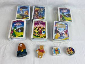 lot 7629 image: McDonalds DISNEY Masterpiece Collection Toys Figurine VHS Movie Promos - New w figurines inside plus more items