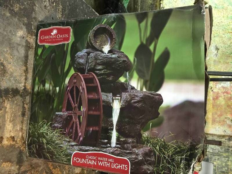 lot 8828 image: Garden Oasis Lighted Rock with Wheel Fountain