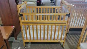 lot 9240 image: Wooden Kaplan Evacuation Baby Crib