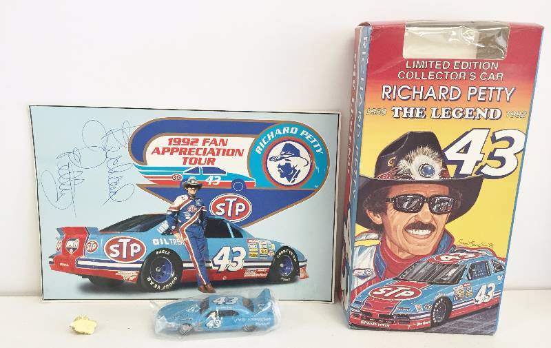 lot 1035 image: Nascar Legend and All Time King - Richard Petty Collectors Set - Autographed Photo , Die Cast Car, Pin  Box Movie Set
