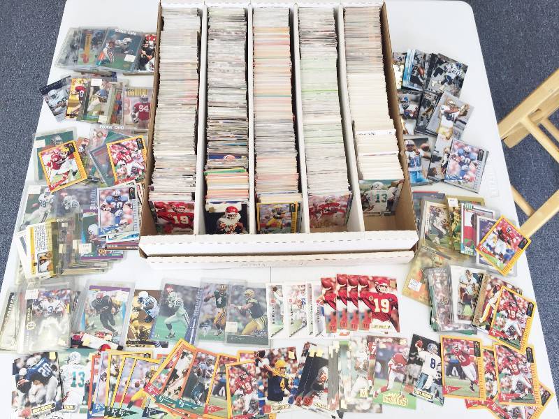 lot 1057 image: 5,000 Count Box Jam Packet With Football Superstars - Rookies - Inserts & More - Book Value Over $500 - A True Treasure Hunt