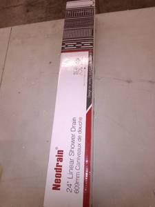 lot 50250 image: Neodrain 24 Inch Rectangular Linear Shower Drain with Brick Pattern Grate, Brushed 304 Stainless Steel Bathroom Floor Drain,Shower Floor Drain Includes Adjustable Leveling Feet