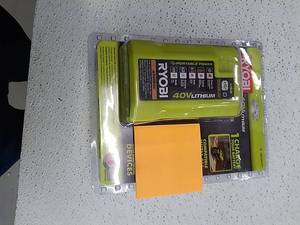 lot 51455 image: Ryobi 40 Volt Compact Wired Lithium-Ion Battery Charger with USB Port