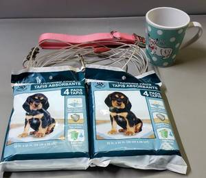 lot 184 image: Dog Supplies, Including Puppy Training Pads & The BookThe Dogist