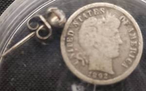 lot 50 image: 1892 P G4 Barber Dime & Possibly Diamond Earring, (Unauthenticated)